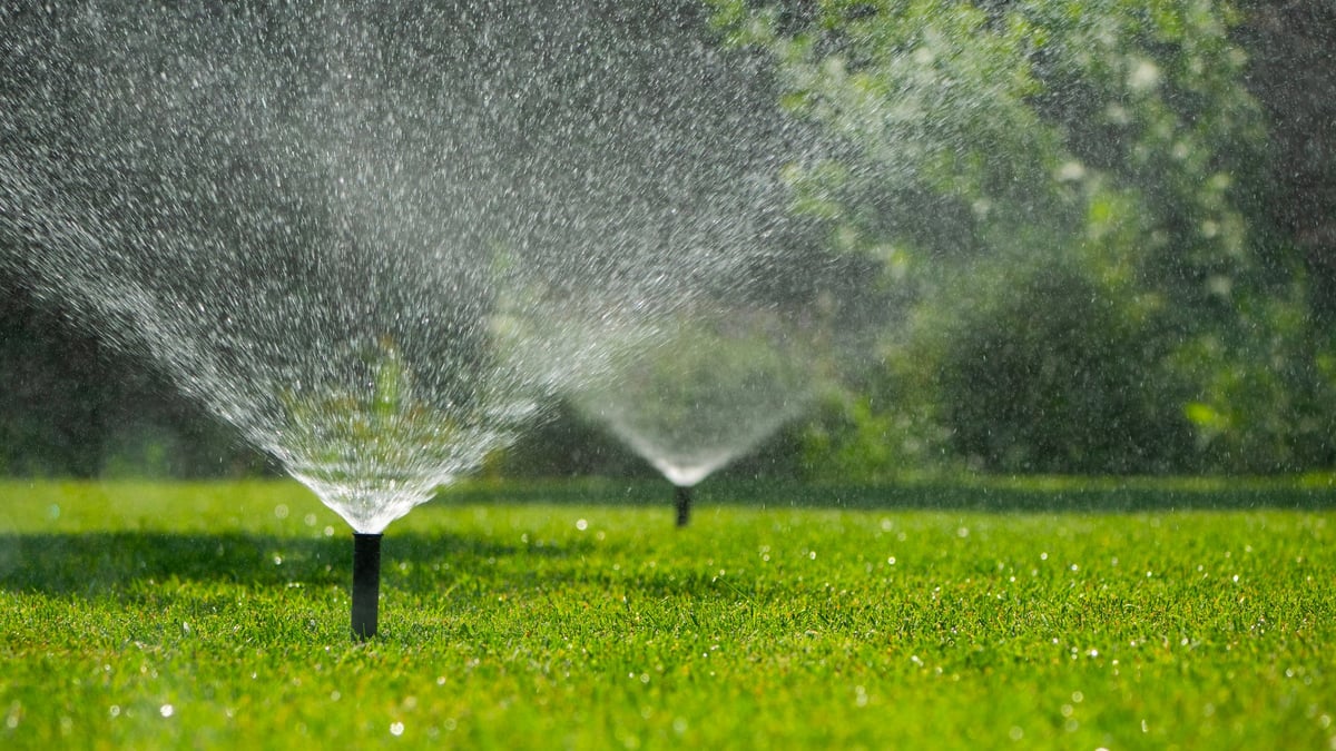 Automatic sprinkler system watering lawn in Sacramento